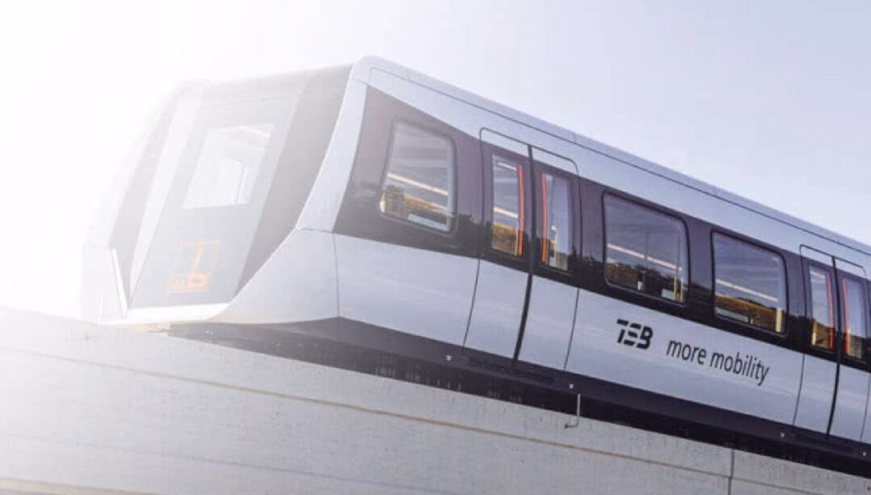 A TSB maglev train runs along its elevated guideway against a bright sky, the words more mobility on its flank.