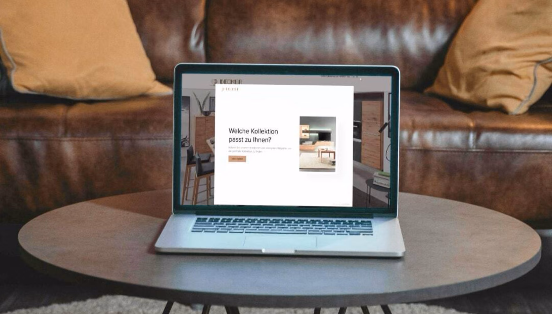 A laptop on a living room coffee table shows a pop-up asking which furniture collection suits the visitor.
