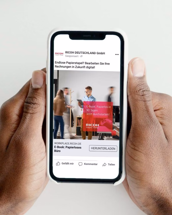 A Ricoh campaign ad on a phone.