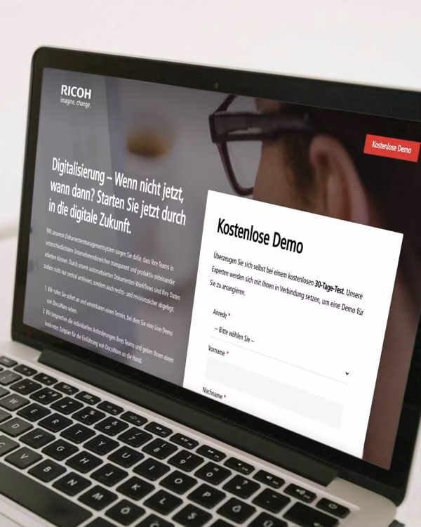 A Ricoh demo form on a laptop.